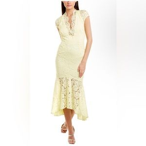 Beautiful, pale yellow delicate lace over a very light cream colored fabric.